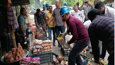 Jamshedpur News : साकची पुराना जेल चौक से हटा अतिक्रमण, दुकानदारों ने किया विरोध