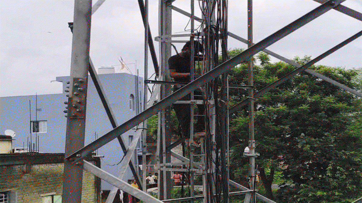 Youth climbs mobile tower